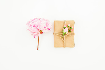 Peony flower and gift box on white background. Flat lay, top view. Valentines day.