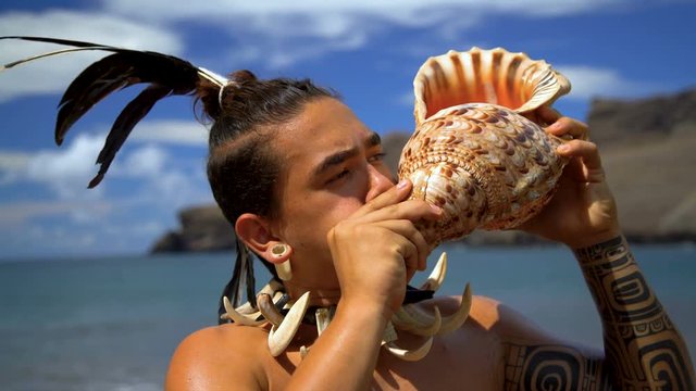Marquesas male blowing conch shell Nuku Hiva Marquesas