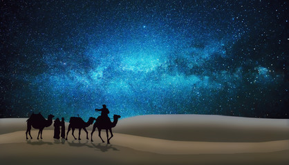 Arabs and camels travel in the desert night under the stars