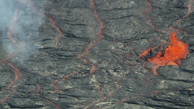 Aerial explosive molten lava spewing from erupting volcano