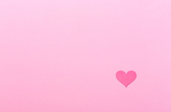 Pink heart on a pink paper background