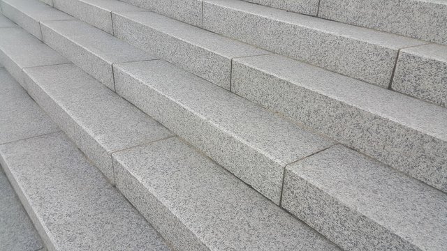 Closeup vire of grey concrete stairs with dark concrete lines on footsteps © Photochowk