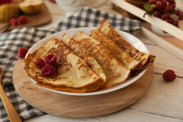 Pancakes Thin homemade pancakes with berries, traditional Russian cuisine. Homemade pancakes with berries