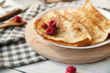 Pancakes Thin homemade pancakes with berries, traditional Russian cuisine. Homemade pancakes with berries