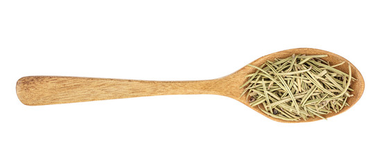 Dried rosemary or rosemarin leaves in wooden spoon isolated on white background top view