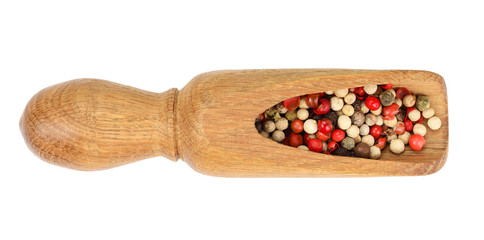 mix of peppercorn in wooden spoon isolated on white background. Top view. Flat lay