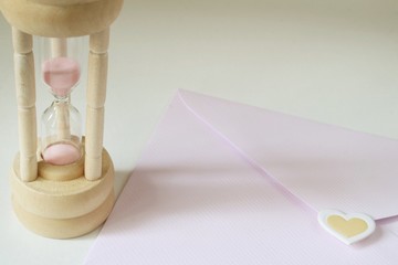 Letter and hourglass, time of nostalgia.