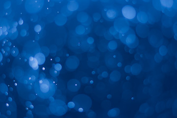 abstract deep blue background with blur bokeh light effect