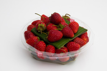 Fresh Red Strawberries on white plate on white background
