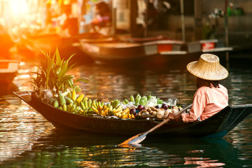Fototapeta fruit seller in wooden boat obraz