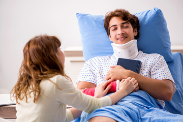 Loving wife looking after injured husband in hospital 