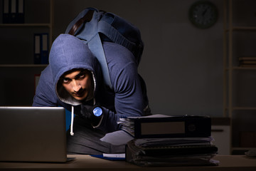 Thief trying to steal personal data in identity theft concept