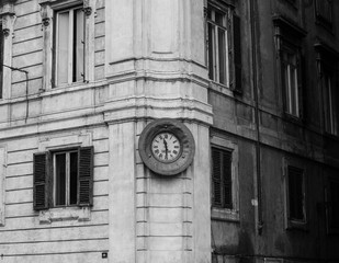clock on facade of an old building