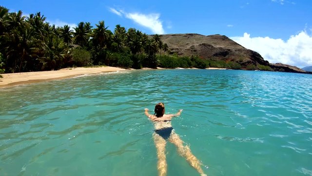 Tahuata Marquesas young female on deserted ocean beach