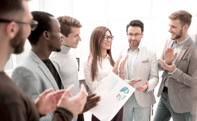 close up.business team applauding while standing in the office