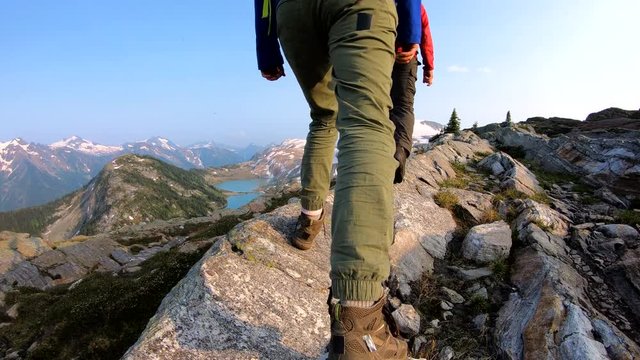 Young people hiking outdoor Rocky mountain wilderness Canada