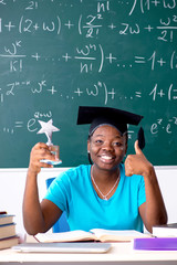 Black female student in front of chalkboard  