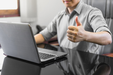 Businessman showing his thumb up,People Celebration Success Working Successful Concept