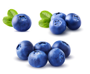 Blueberries set with leaves isolated on white background.