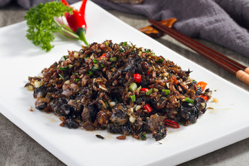 Spicy agaric fried chicken in a white dish