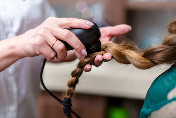 Hair doctor checking hair. Diagnostics hair and scalp. Trihoskopiya. Doctor examine patient female...