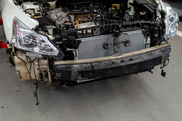 car in repair station and body shop with soft-focus and over light in the background