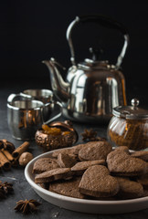 Vegan heart gingerbread cookies on dark background