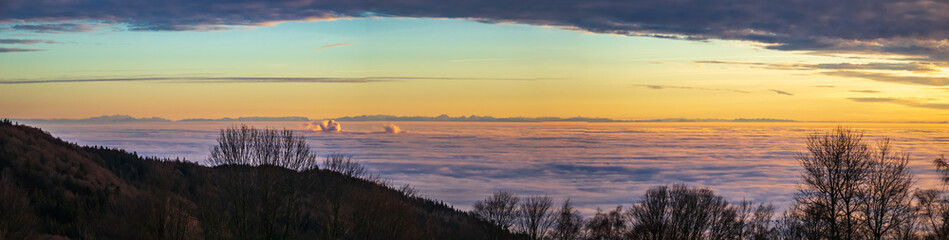 High resolution stitched sunset panorama above the clouds with alps in 200 km distance at the Grandsberg-Schwarzach-Bavaria-Germany