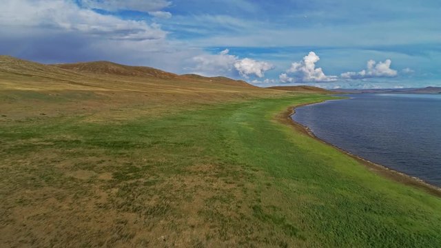 Calm Waters Of Mongolian Lake Telmen Lake Surrounded By Hills. Mongolia.