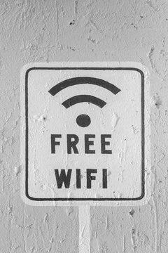 free wifi sign on white brick wall background