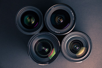Set of various DSLR lenses with colorful reflections