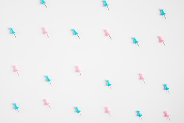 Set of office pins lies on a white background.