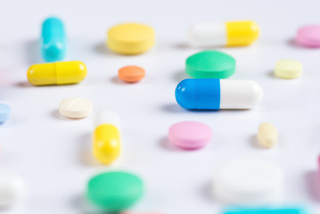Tablets and pills on a white background