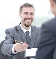 closeup.a successful businessman, signing a lucrative contract