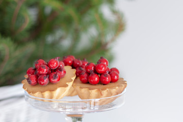 delicious christmas cupcake with glazed red berries 