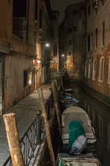 Night in Venice. Boats float in canal