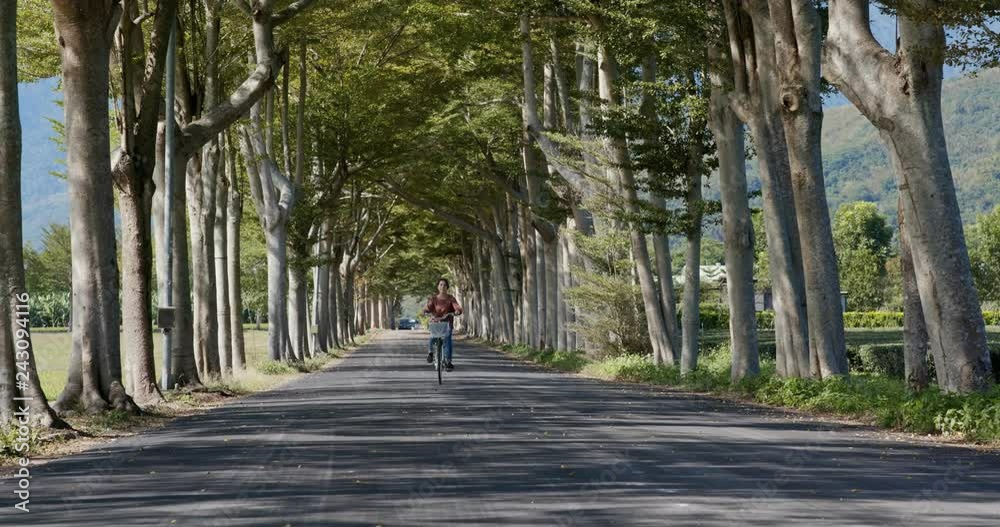 Sticker Woman ride a bike in countryside