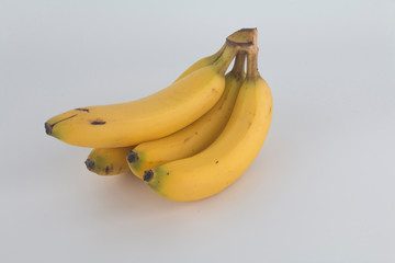 a tasty yellow banana with a white background
