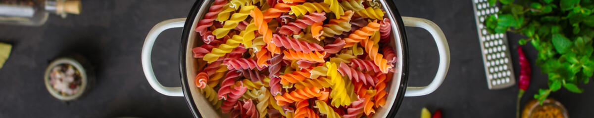 pasta, ingredients, tomato sauce (slate on the table cutting board). top view. copy space