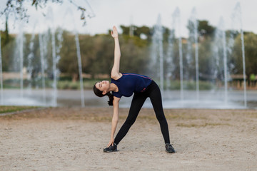 young girl warming at the city park