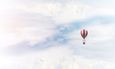 Flying hot air balloon in the air.