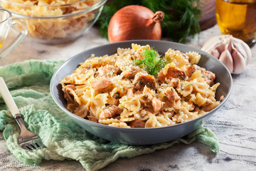 Creamy farfalle pasta with salmon, parmesan cheese and dill