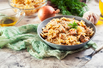 Creamy farfalle pasta with salmon, parmesan cheese and dill