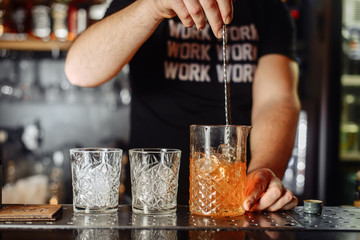 Cocktail Preparation. The barman is preparing a drink.
