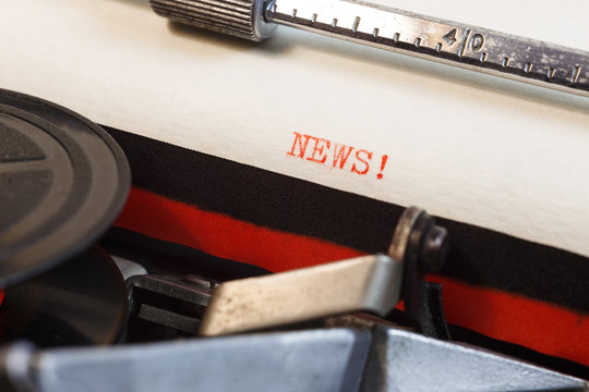 News. The text is typed on a vintage typewriter, close up.