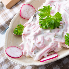 delicious homemade meat salad with mayonnaise and cucumber