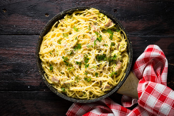 Pasta carbonara with bacon and cream sauce top view. 