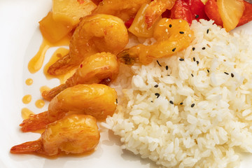 shrimp with rice on a white plate. restaurant menu. close-up of food