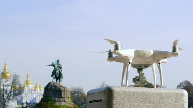 Drone takes off against the background of the Bogdan Khmelnytsky monument. Aerial shooting of historic sites