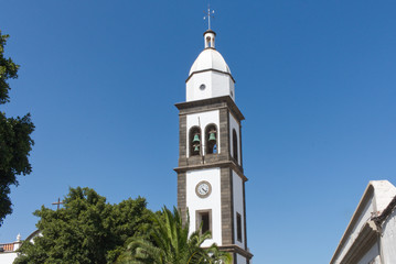 Fototapeta na wymiar Arrecife landmark San Gines church with tower bells, Lanzarote, Spain